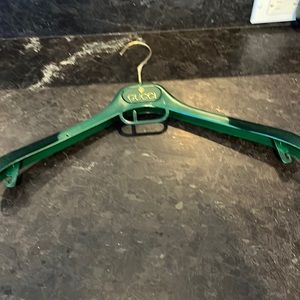 Vintage Gucci hanger. Green. Velvet in each end.